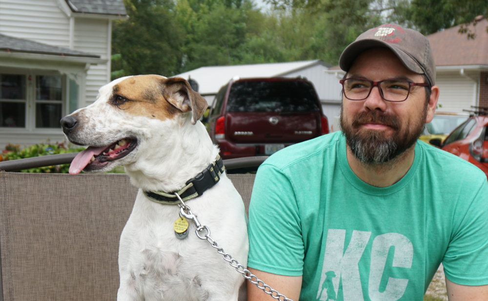 Photo of Shannon Bond on right and Milo the dog on left