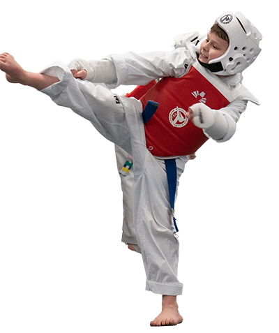 Child kicking in martial arts class wearing padded armor. 