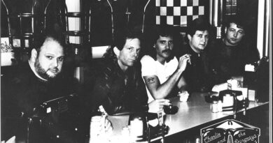 Charlie and the Stingrays Band members sitting at diner countertop.