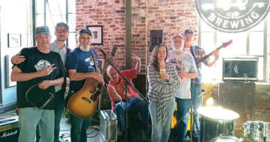 Musicians stand on stage at the River Bluff Brewery in St. Joseph, Missouri.