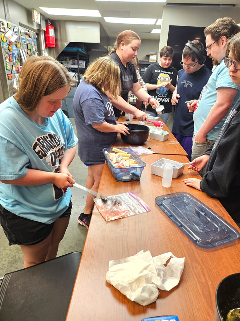 Associates make food at Fulfillment House in Kearney, Missouri. 