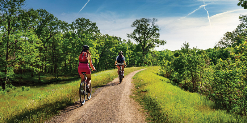 Cyclists riding on trail.