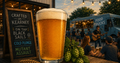 Beer pint with sign and food truck.
